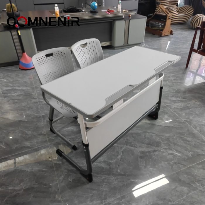 Double school desk with front panel and two perforated-back chairs